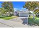 Charming single-Gathering home boasts a well-manicured lawn, a brick driveway, and a two-car garage at 4716 Block Island Ln, Clermont, FL 34714