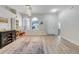 Inviting living room with hardwood floors, neutral paint, arched windows, and decorative shelving at 4716 Block Island Ln, Clermont, FL 34714