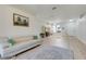 Spacious living room featuring hardwood floors, a modern chandelier, and lots of natural light at 4716 Block Island Ln, Clermont, FL 34714