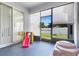 Enclosed patio area with toys, creating a safe and enjoyable space for children to play outdoors at 4716 Block Island Ln, Clermont, FL 34714
