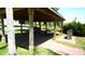 Inviting outdoor pavilion with ample seating and a stone trash receptacle at 4716 Block Island Ln, Clermont, FL 34714