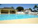 Community pool offers ample space for swimming and relaxation at 4716 Block Island Ln, Clermont, FL 34714
