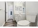 Bathroom featuring a white vanity, a toilet, and light wood floors at 508 Woodview Dr, Tavares, FL 32778