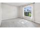 Bright bedroom featuring neutral carpet, a large window, and neutral paint at 508 Woodview Dr, Tavares, FL 32778