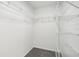 Walk-in closet featuring wire shelving and neutral carpeting at 508 Woodview Dr, Tavares, FL 32778