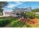 Well-maintained home featuring dormer windows, lovely landscaping and charming front porch at 508 Woodview Dr, Tavares, FL 32778