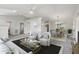 Bright and airy living room with modern furnishings, skylight, and neutral color palette at 508 Woodview Dr, Tavares, FL 32778