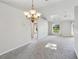 Open living spaces with skylight, ceiling fan, and easy access to other rooms at 508 Woodview Dr, Tavares, FL 32778