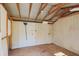 Interior of the shed with plywood floor and walls plus exposed beams for support at 508 Woodview Dr, Tavares, FL 32778