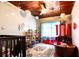 Charming bedroom with wood ceilings, ceiling fan, ship themed bed, and decorative accents at 513 Barwick St, Wildwood, FL 34785
