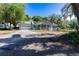 A charming single-story home featuring a screened front porch, garage, and a driveway with ample parking at 513 Barwick St, Wildwood, FL 34785