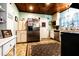 Bright kitchen with stainless steel appliances, ample cabinet space, and a vintage rug at 513 Barwick St, Wildwood, FL 34785