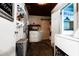 Well-organized laundry room with ample storage, a washer, dryer, and a barn-style sliding door at 513 Barwick St, Wildwood, FL 34785
