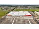 Aerial view of a Target retail location, with ample parking, surrounded by homes and other businesses at 5333 Loblolly Ln, Wildwood, FL 34785