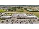 Aerial view of a Publix retail location, with ample parking, surrounded by homes and other businesses at 5333 Loblolly Ln, Wildwood, FL 34785