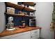 Walk-in pantry featuring wooden shelving, butcher block countertop, and stainless steel appliances at 5333 Loblolly Ln, Wildwood, FL 34785