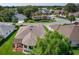 Aerial view features the home, manicured lawn, and surrounding neighborhood, showcasing the property's location at 541 Carrera Dr, The Villages, FL 32159