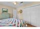 Bedroom featuring a large closet, neutral walls, and wood-look flooring at 541 Carrera Dr, The Villages, FL 32159