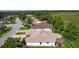 This home boasts a manicured lawn, mature trees, and a screened in patio at 541 Carrera Dr, The Villages, FL 32159