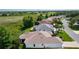 This home features a well-manicured lawn, mature trees, and a screened in patio at 541 Carrera Dr, The Villages, FL 32159