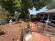 Lush, well-maintained backyard with mature trees and manicured landscaping at 603 W Seminole Ave, Eustis, FL 32726