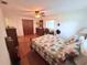 The bedroom features hardwood floors, a ceiling fan and closet at 603 W Seminole Ave, Eustis, FL 32726