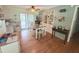 Inviting dining room with hardwood floors, built-in shelving, and natural light at 603 W Seminole Ave, Eustis, FL 32726