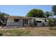Charming single-story home with a cozy front porch and well-maintained lawn at 603 W Seminole Ave, Eustis, FL 32726