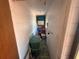 Narrow storage hallway leading to an outdoor space at 603 W Seminole Ave, Eustis, FL 32726