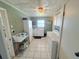 The laundry room includes a washing machine, dryer, sink, and storage space at 603 W Seminole Ave, Eustis, FL 32726