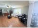 Inviting living room with hardwood floors, a ceiling fan and ample seating at 603 W Seminole Ave, Eustis, FL 32726