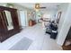 Open-concept living room featuring tile flooring and neutral wall colors at 603 W Seminole Ave, Eustis, FL 32726