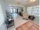 Bright living room with tile floors, a ceiling fan and comfortable seating at 603 W Seminole Ave, Eustis, FL 32726