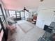 Bright sunroom with tile floors, fan, and many windows at 603 W Seminole Ave, Eustis, FL 32726