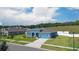 Charming blue single Gathering home with well manicured landscaping at 6042 Claystone Way, Mount Dora, FL 32757