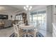 Cozy dining area with sliding door to an outdoor patio for al fresco dining and relaxation at 6042 Claystone Way, Mount Dora, FL 32757