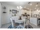 Cozy dining area adjacent to the kitchen, creating a warm and inviting atmosphere for Gathering meals at 6042 Claystone Way, Mount Dora, FL 32757