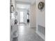 Inviting entryway with tile flooring, neutral decor and decorative lighting at 6042 Claystone Way, Mount Dora, FL 32757