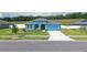 Charming blue single Gathering home with well manicured lawn and landscaping at 6042 Claystone Way, Mount Dora, FL 32757