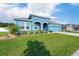 Charming blue single Gathering home with well manicured landscaping at 6042 Claystone Way, Mount Dora, FL 32757