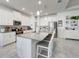 Kitchen with a large center island offering ample counter space and seating for casual dining at 6042 Claystone Way, Mount Dora, FL 32757