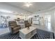 Open-concept living room that seamlessly connects to the kitchen and dining area, ideal for entertaining at 6042 Claystone Way, Mount Dora, FL 32757