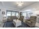 The living room boasts lots of natural light and an open layout, creating a comfortable atmosphere at 6042 Claystone Way, Mount Dora, FL 32757