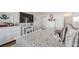 Bedroom featuring a bed with decorative pillows, white dressers, and a television on the wall at 6042 Claystone Way, Mount Dora, FL 32757