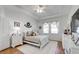 Bedroom featuring a bed with decorative pillows, white dressers, and a ceiling fan at 6042 Claystone Way, Mount Dora, FL 32757