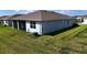Large backyard features a screened lanai, creating a serene outdoor living space at 6203 Sw 93Rd Loop, Ocala, FL 34476
