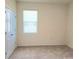 Bright bedroom with neutral walls, carpeted floors, and a window that offers natural light at 6203 Sw 93Rd Loop, Ocala, FL 34476