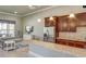 Clubhouse kitchenette area with granite countertops, stainless steel appliances, and seating area at 6203 Sw 93Rd Loop, Ocala, FL 34476