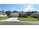 Charming one-story home featuring a two-car garage, well-maintained lawn, and inviting curb appeal at 6203 Sw 93Rd Loop, Ocala, FL 34476