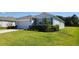 Attractive one-story home with well-manicured landscaping, a driveway, and an attached two-car garage at 6203 Sw 93Rd Loop, Ocala, FL 34476